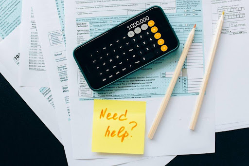 Black Smartphone on top of accounting compliance documents