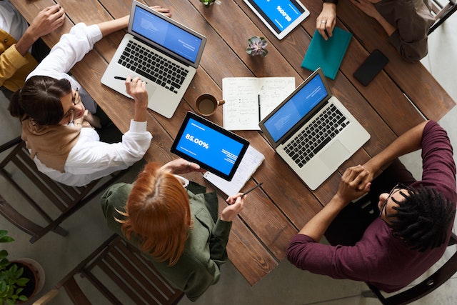 group of accountants working together on their laptops 