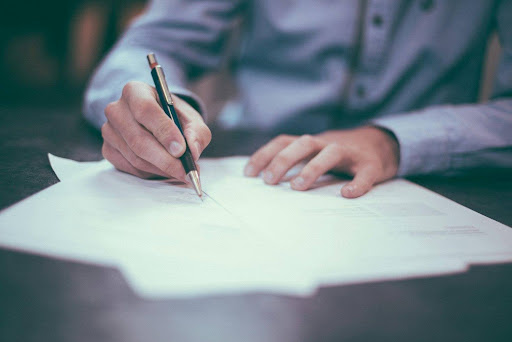 business owner working on accounting year end checklist