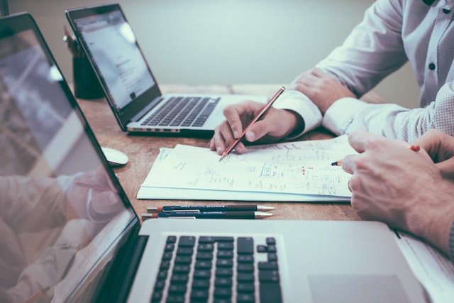 Bookkeepers working on a proposal template for clients 