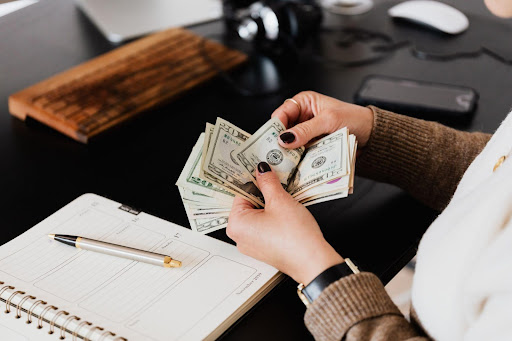 accounting counting money for her firm 