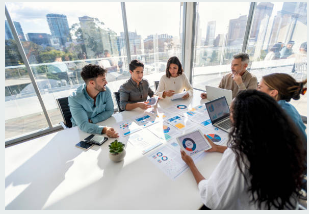 employees creating advanced data reporting together