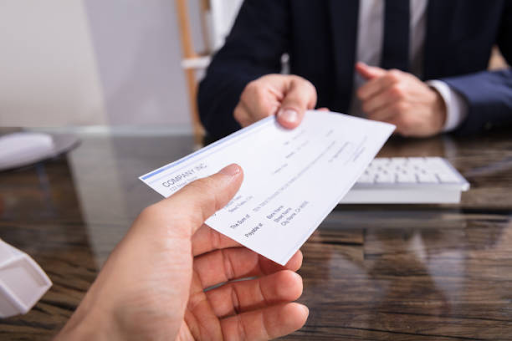 accountant sharing a check and tips on how do you void a check