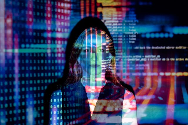woman with a projected image of digital data