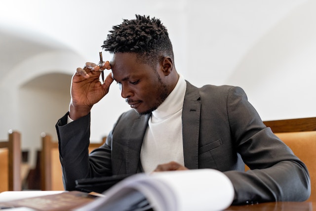 Man owning an accounting firm working at desk