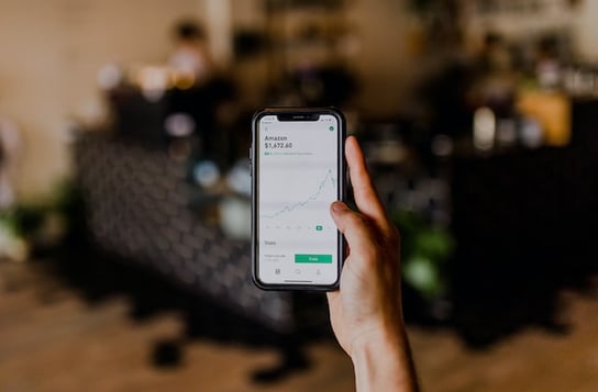 person using phone to solve small business accounting solutions 