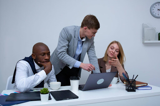 Three tax professionals reviewing sox compliance accounting 