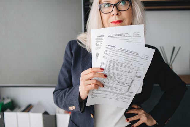 women standing with tax documents