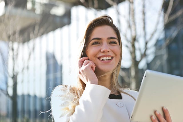 women talking on the phone and with laptop-about accounting technology trends