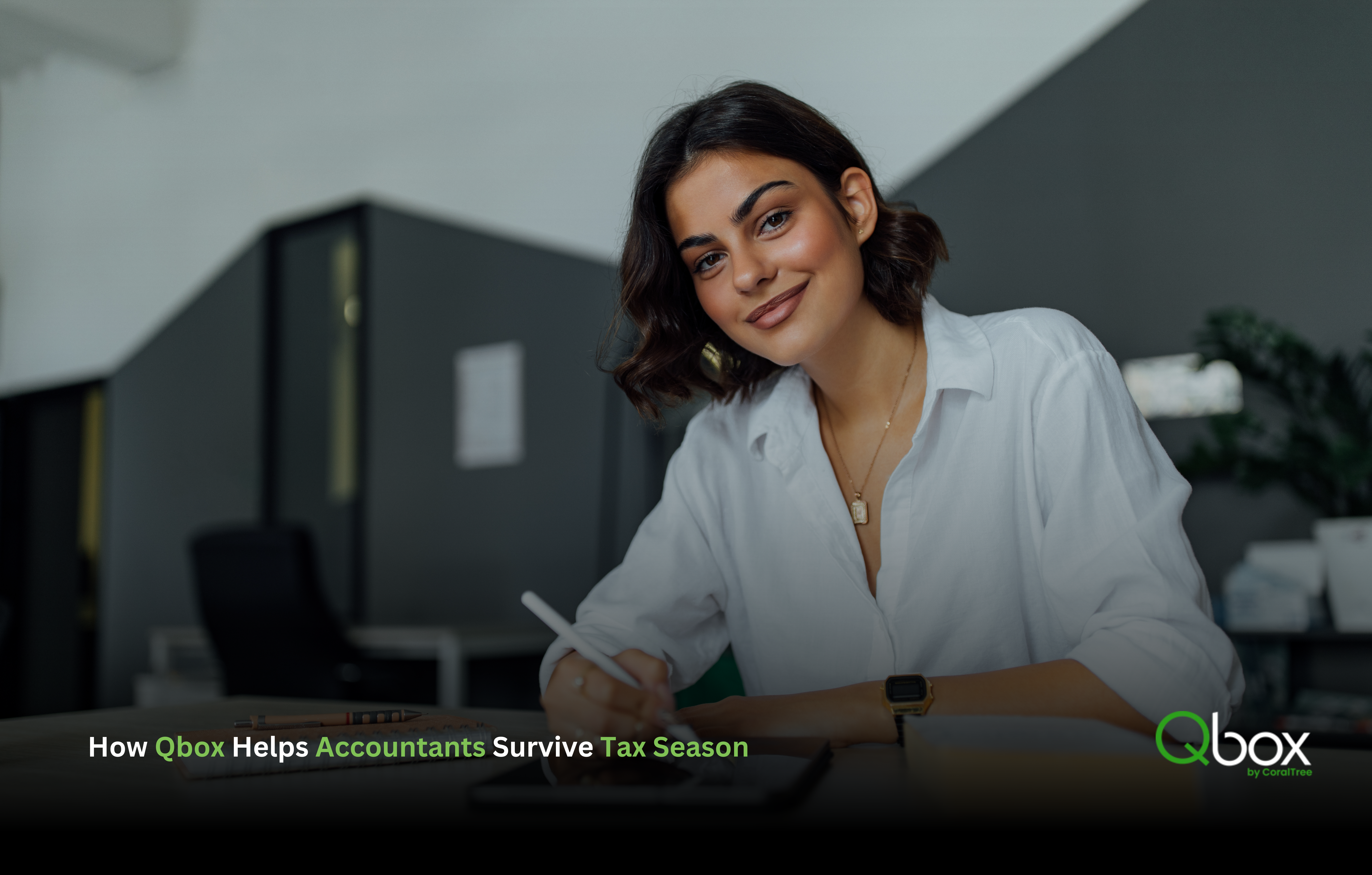 Accountant writing on a digital tablet at her desk to survive tax season