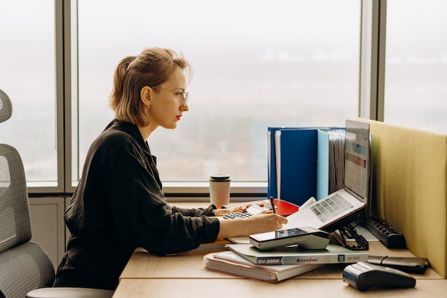 cpa vs accountant woman working in office on laptop 