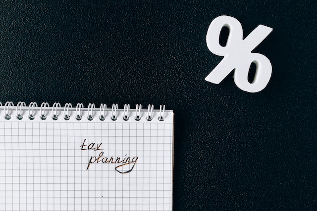 End of year tax planning on paper and percentage sign 