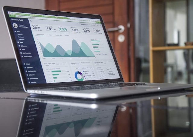 A person working on a laptop using small business accounting software