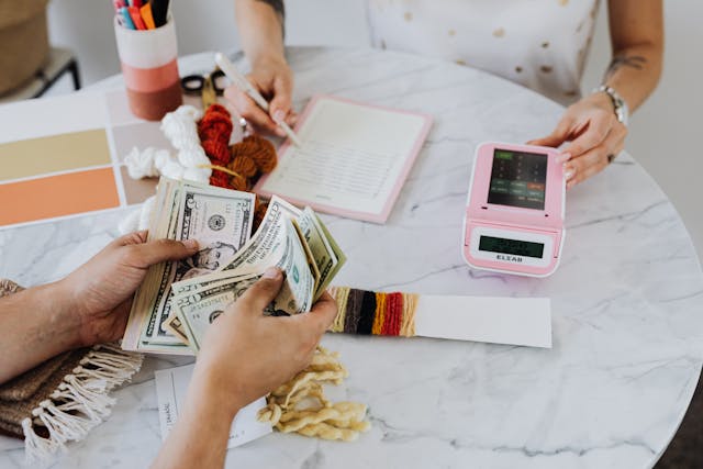 tax professional counting money to decrease in account receivable cash flow