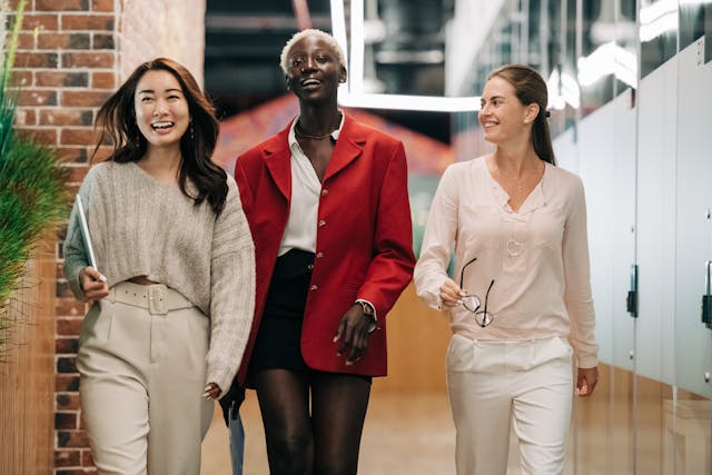 three ladies walking and talking about career advancement for accountants